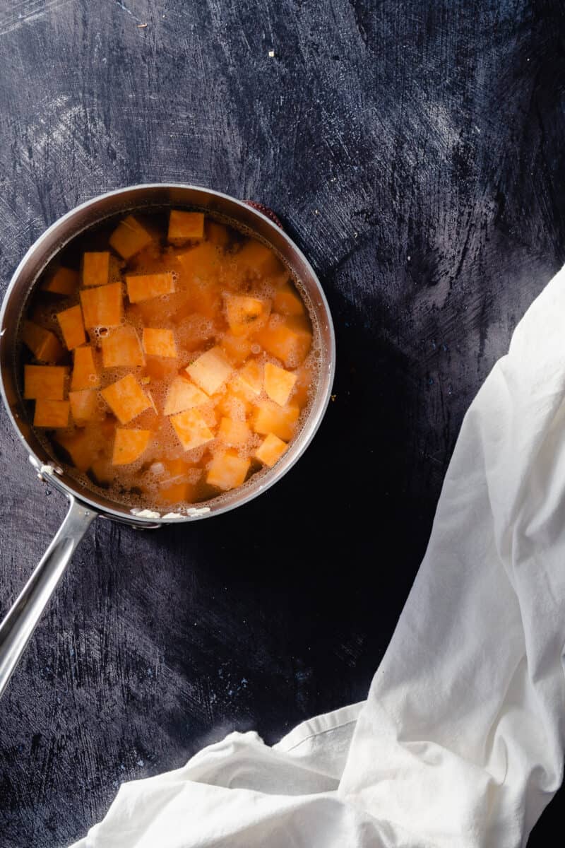 Sweet potato cubes in a pot with water