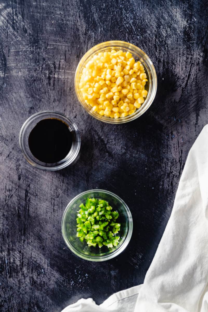 Bowls of sweet corn, molasses, and minced jalepeno