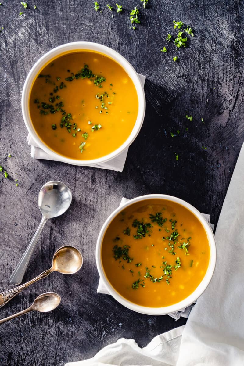 Corn, Jalapeno, and Sweet Potato Bisque in two bowls