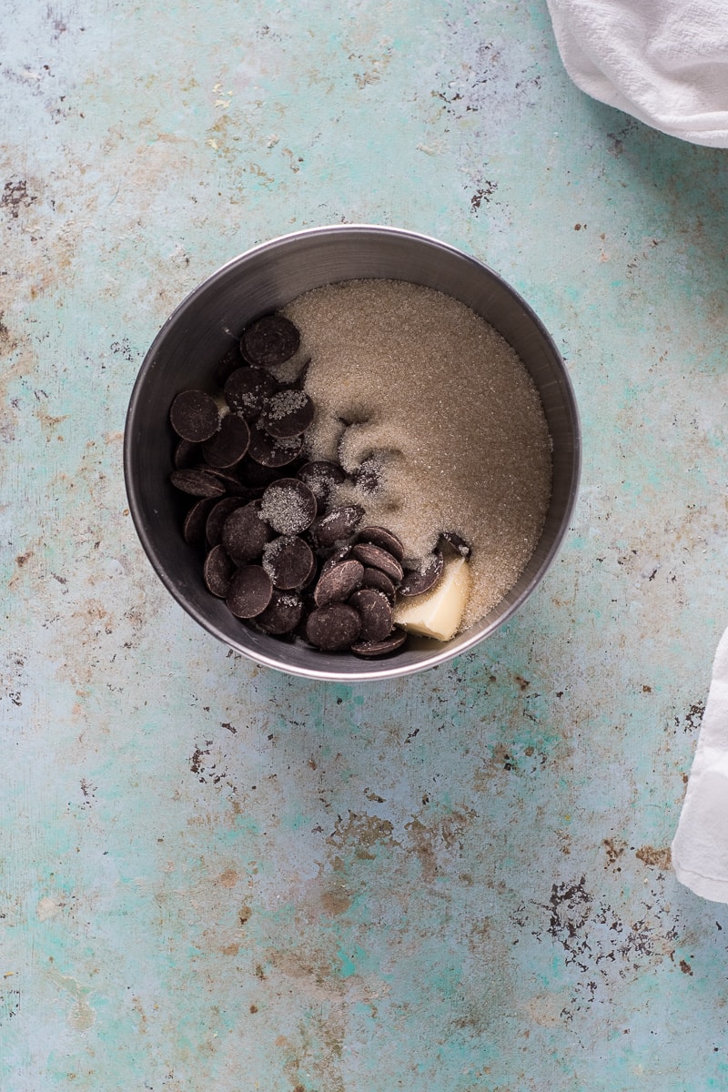 Chocolate, sugar, and butter in a mixing bowl