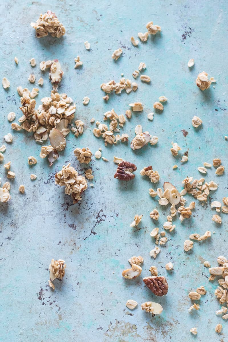 Maple Nut Granola strewn across a table, overhead view