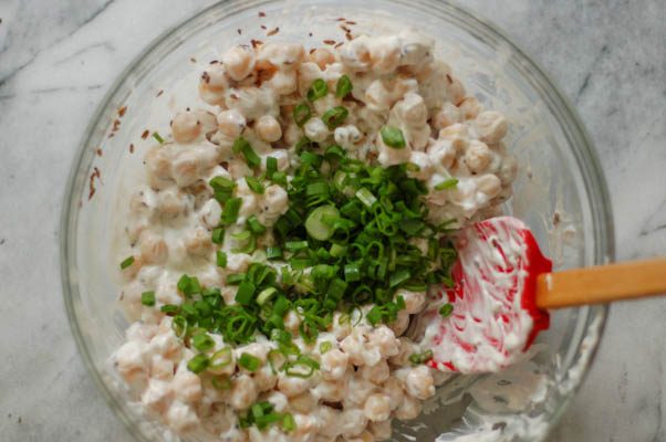 Chickpeas mixed with yogurt and spiced oil