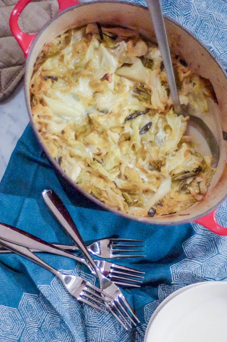 Savoy Cabbage Gratin in a red Dutch oven overhead view