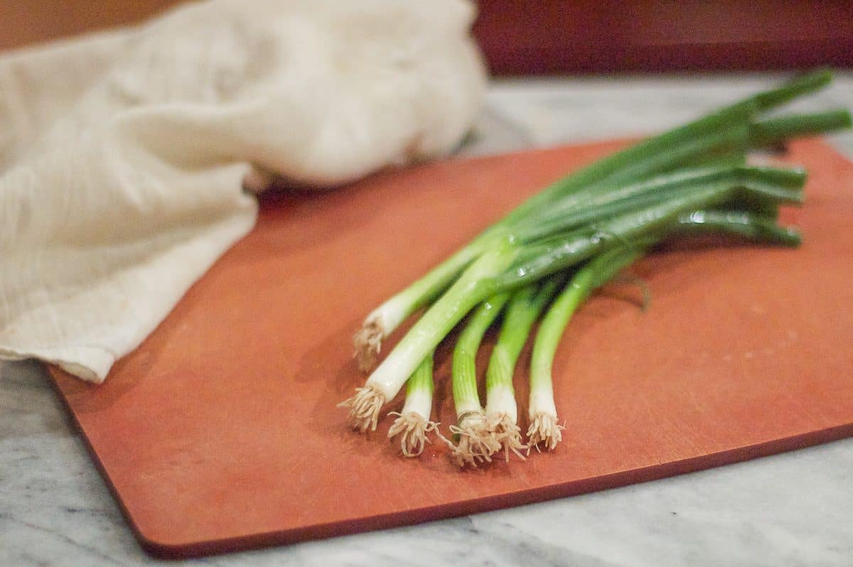 Green onions on a cutting board