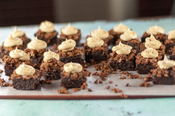 Peanut Butter Crunch Brownies. Fudgy brownies with a crisp layer of chocolate-peanut-butter feuilletine topped with a swirl of salted peanut butter buttercream. Salty, sweet, crispy, creamy, delicious! From Blossom to Stem | Because Delicious www.blossomtostem.net