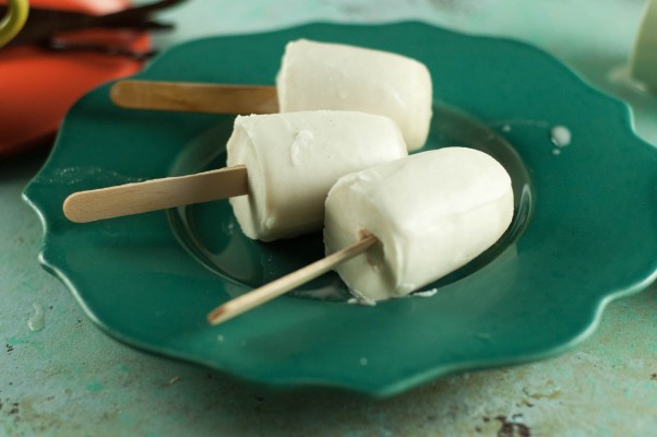 Vanilla Bean Coconut Popsicles. A rich, creamy, coconutty, vanilla-bean flecked frozen treat that's so simple to make. Low in sugar and dairy free. From Blossom to Stem | Because Delicious www.blossomtostem.net