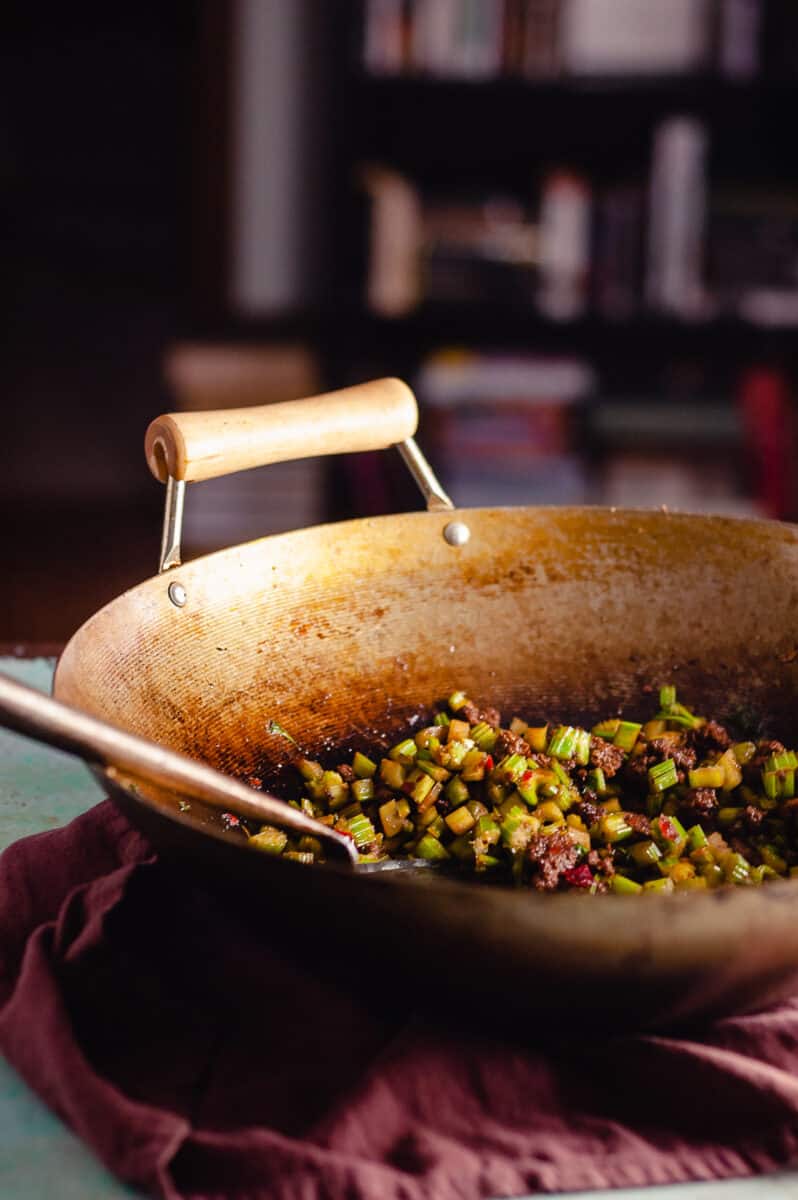 Sichuan send-the-rice-down chopped celery with beef in a wok