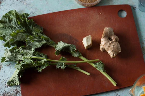 Pineapple Mango Ginger Green Smoothie. A bright green kale smoothie with tropical fruit, ginger, probiotics from kefir. A perfect way to start the day. From Blossom to Stem | Because Delicious | www.blossomtostem.net