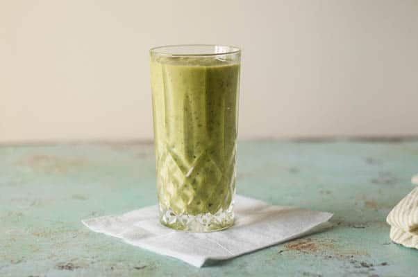 Pineapple Mango Ginger Green Smoothie. A bright green kale smoothie with tropical fruit, ginger, probiotics from kefir. A perfect way to start the day. From Blossom to Stem | Because Delicious | www.blossomtostem.net