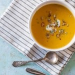 Roasted Heirloom Squash and Tart Apple Soup. A sweet and tart and savory fall soup with red kuri squash and tart apples topped with caramelized pepitas. Gluten free, vegetarian-friendly. From Blossom to Stem | Because Delicious | www.blossomtostem.net