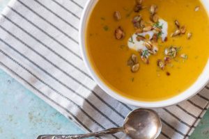 Roasted Heirloom Squash and Tart Apple Soup. A sweet and tart and savory fall soup with red kuri squash and tart apples topped with caramelized pepitas. Gluten free, vegetarian-friendly. From Blossom to Stem | Because Delicious | www.blossomtostem.net