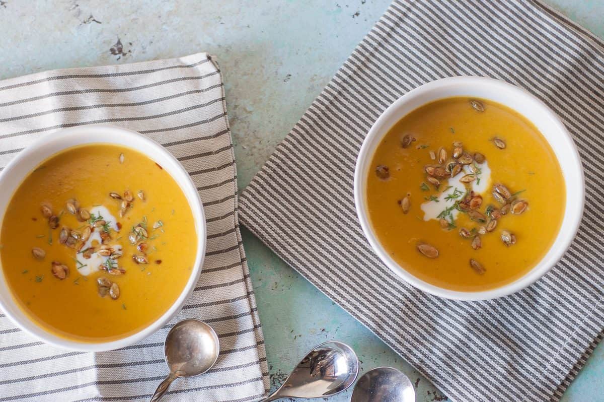 Two bowls of roasted heirloom squash and tart apple soup