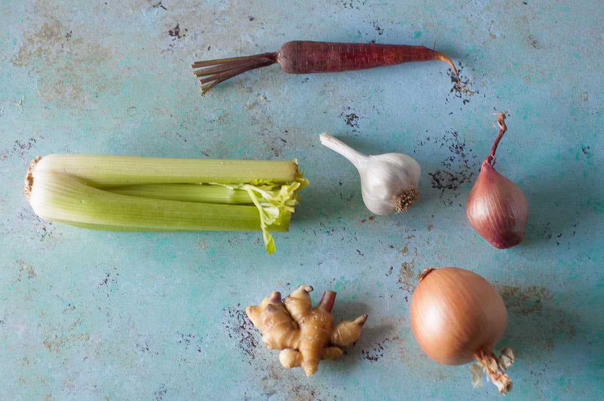 Carrot, celery, garlic, shallots, and giner