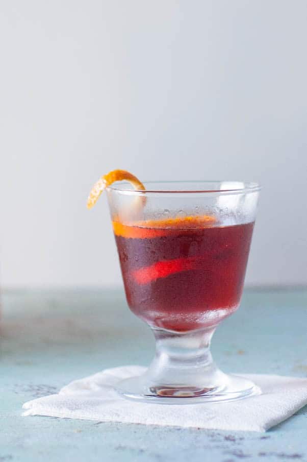 Smoked Barrel-Aged Negroni (no barrel required). A classic Negroni cocktail gets instantly infused with smoky applewood in an ISI cream whipper. Science! From Blossom to Stem | Because Delicious | www.blossomtostem.net