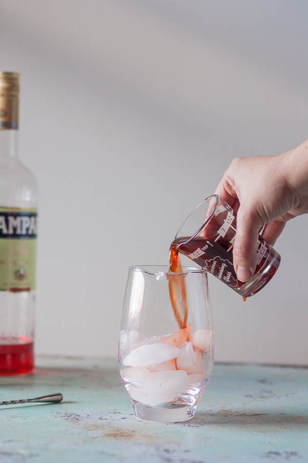 Smoked Barrel-Aged Negroni (no barrel required). A classic Negroni cocktail gets instantly infused with smoky applewood in an ISI cream whipper. Science! From Blossom to Stem | Because Delicious | www.blossomtostem.net