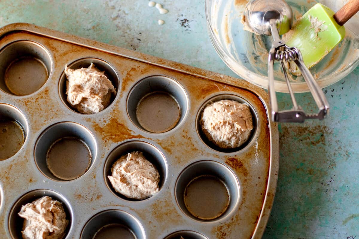 Muffin batter in a muffin tin