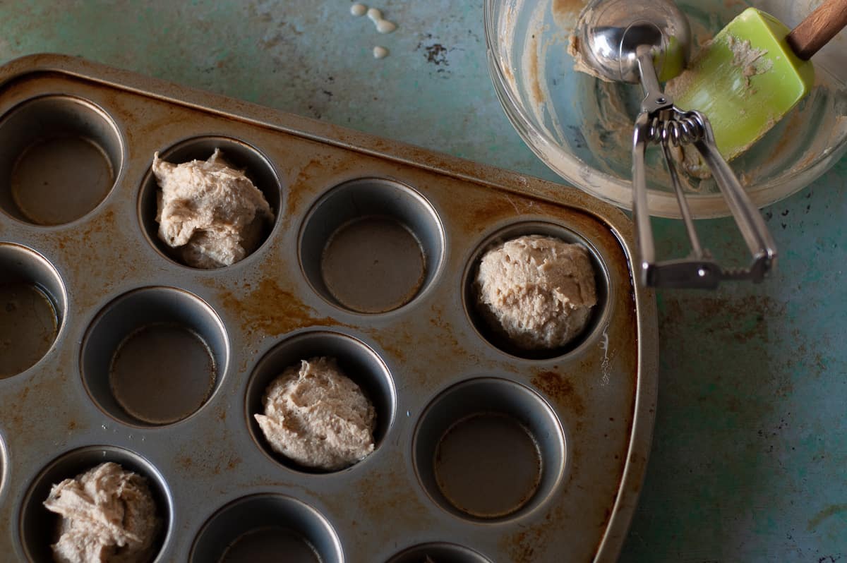 Muffin batter in a muffin tin