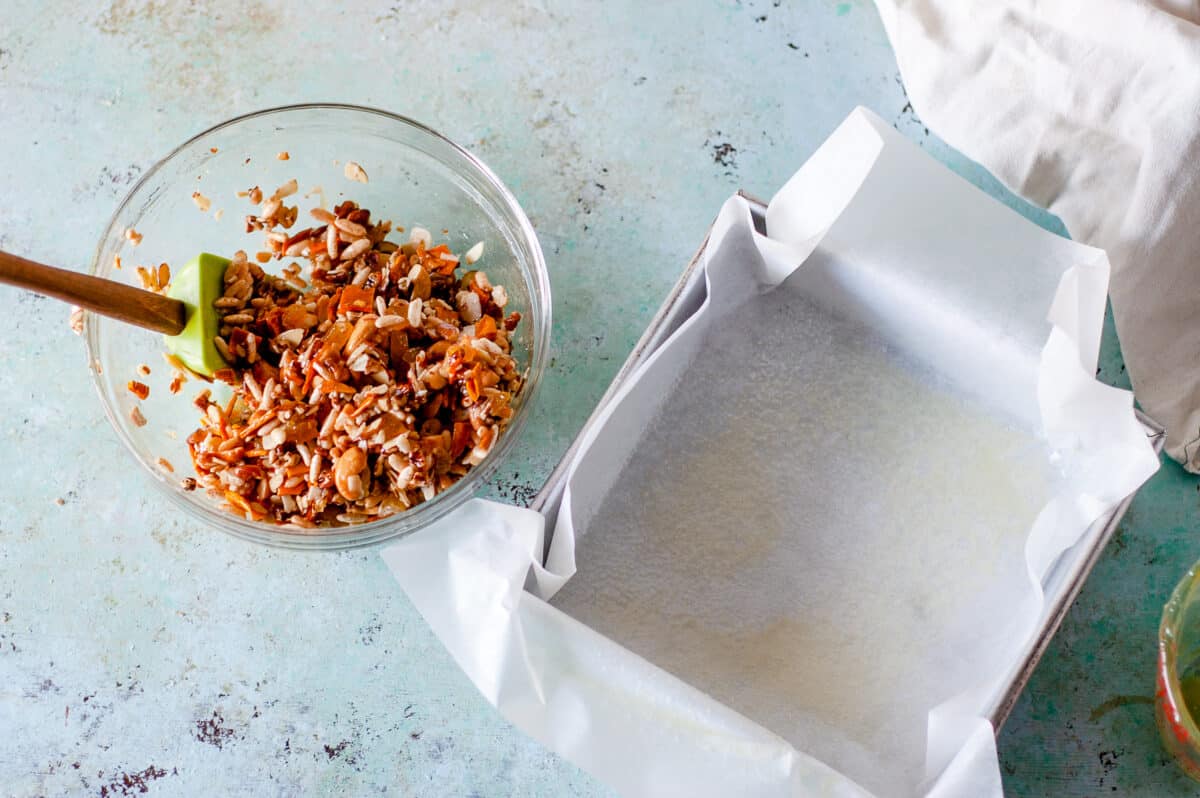 Kind bar mixture in a bowl next to a pan