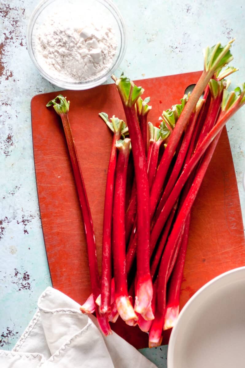 Stalks of rhubarb on a cutting board