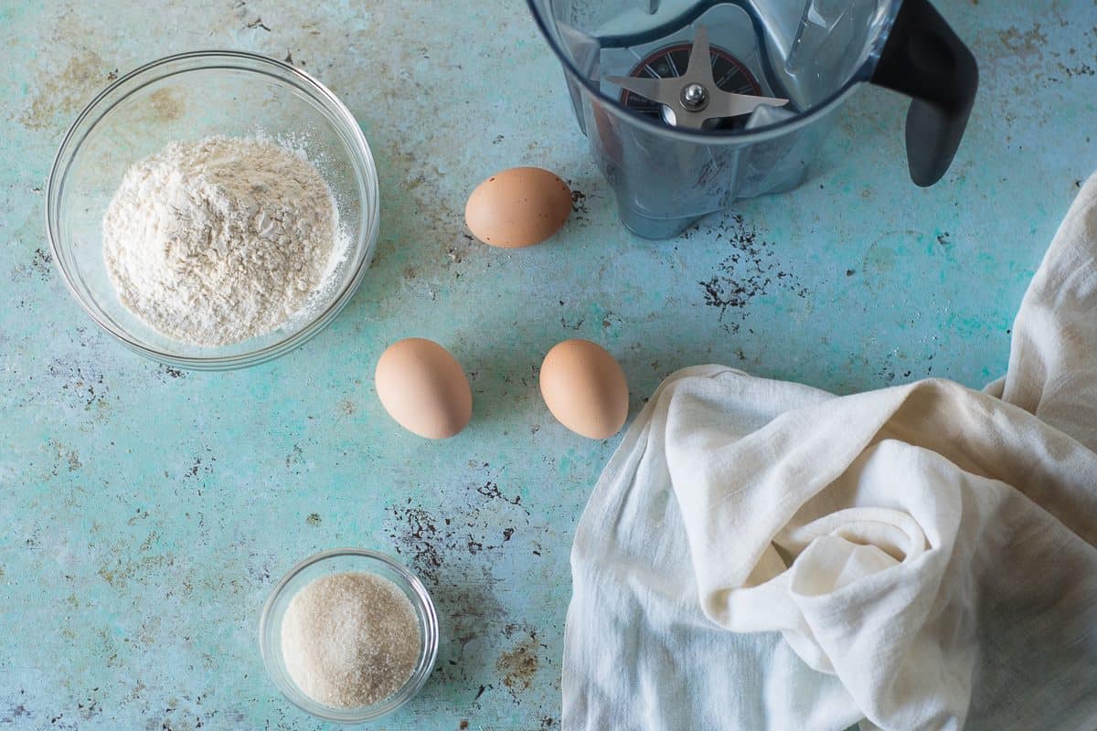 Eggs, Flour, and Sugar next to a blender