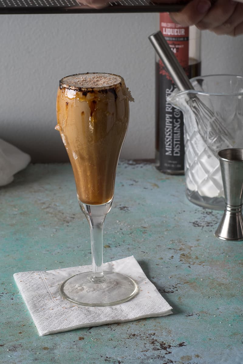 Grating nutmeg over the top of the Spanish Coffee