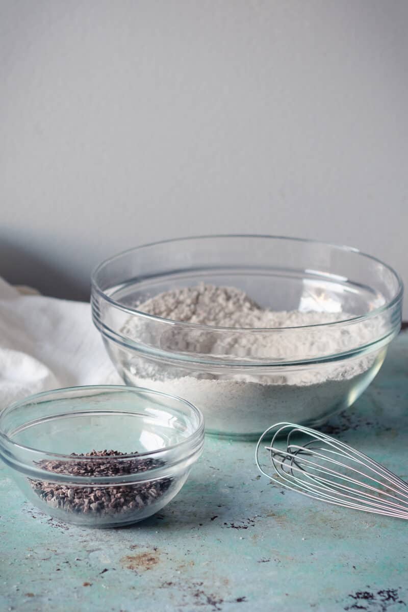 Cocoa nibs and flour in mixing bowls