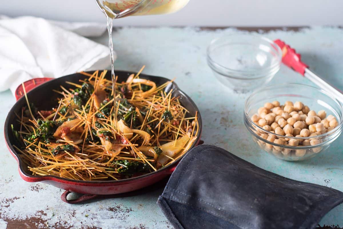 Pouring wine over pasta