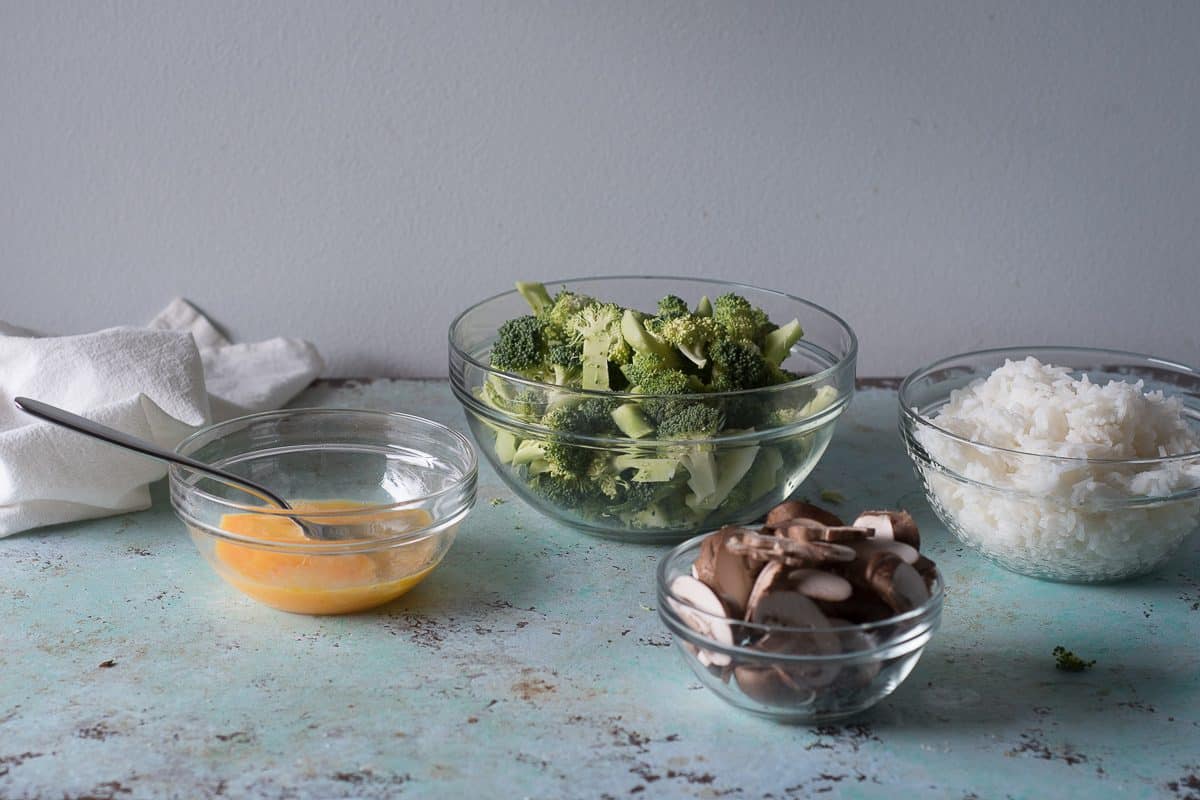beaten eggs, slice broccoli, sliced mushrooms, and cooked rice