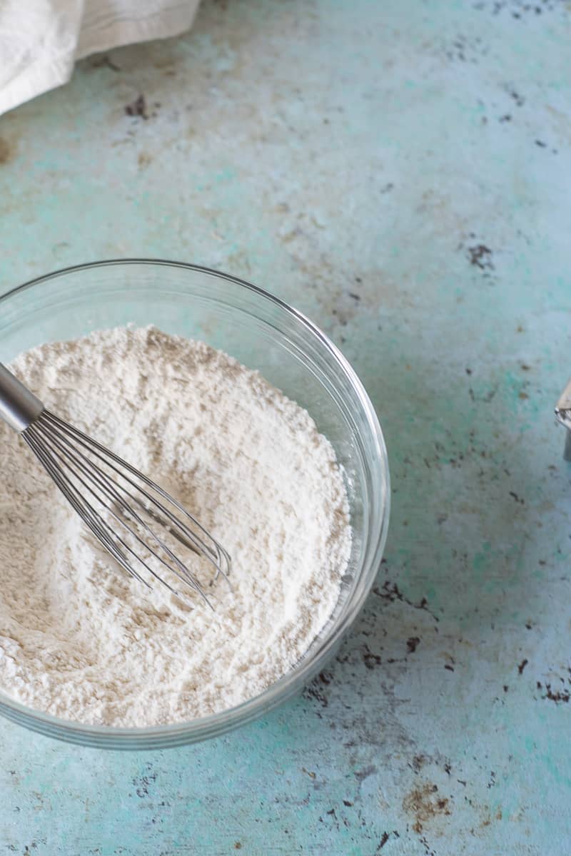 Flour in a bowl with a whisk