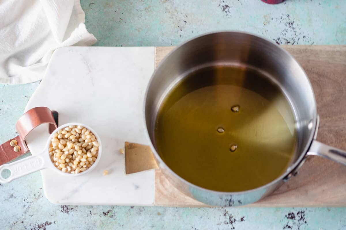 Oil and a few popcorn kernels in a saucepan