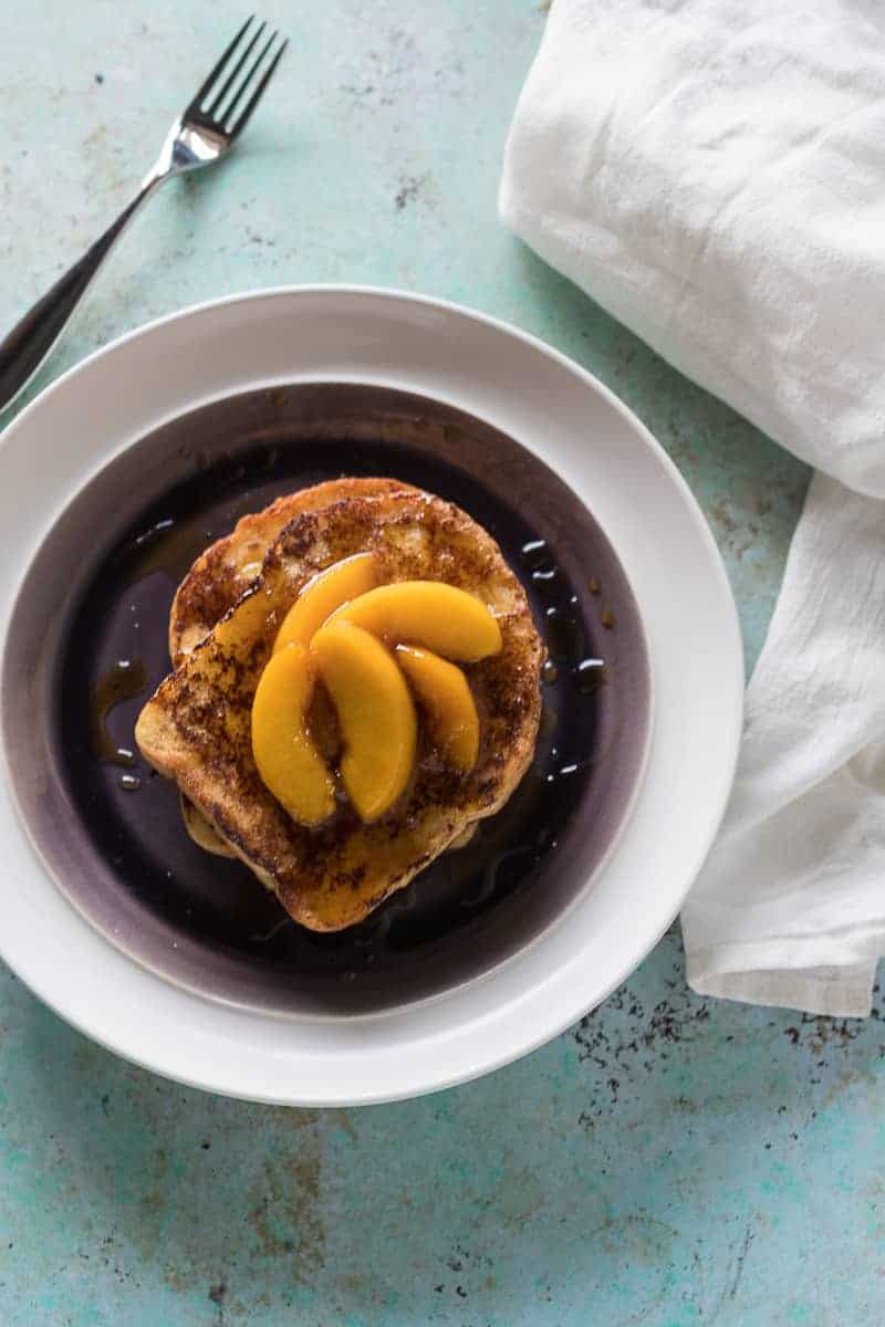 Buttermilk French Toast with Maple Glazed Peaches. Familiar French toast gets some unexpected tang from buttermilk, a quick and easy brunch.