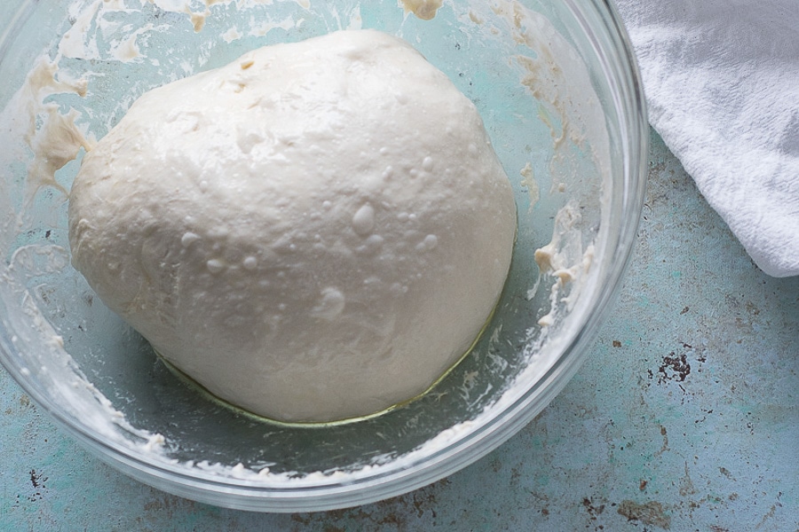 The best pizza dough, chewy thin crust with a puffy rim Blossom to Stem