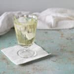 Clarified English Milk Punch in a glass over ice