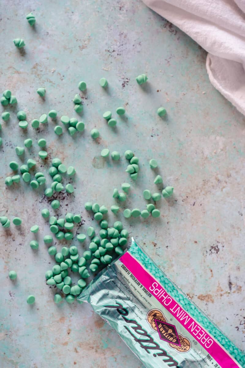 Green Mint Chips scattered on a counter