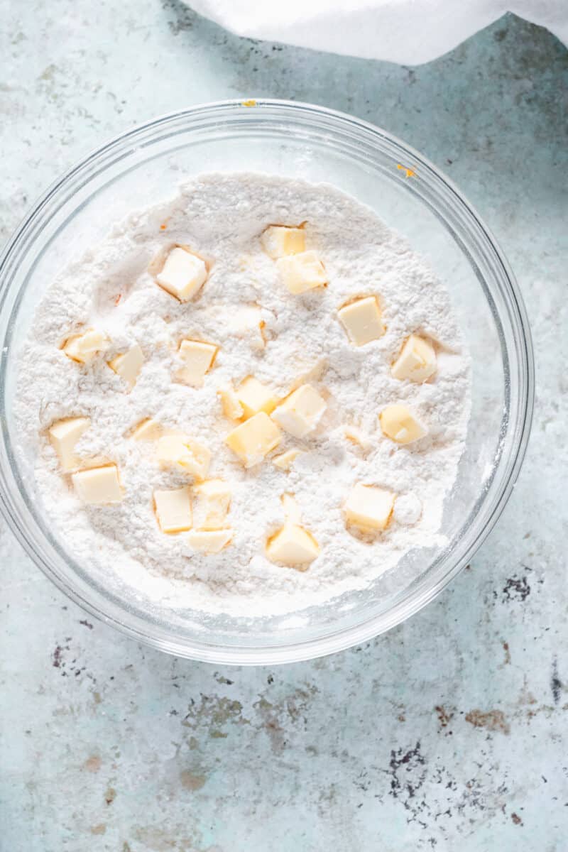 Chunks of butter in a flour mixture in a mixing bowl