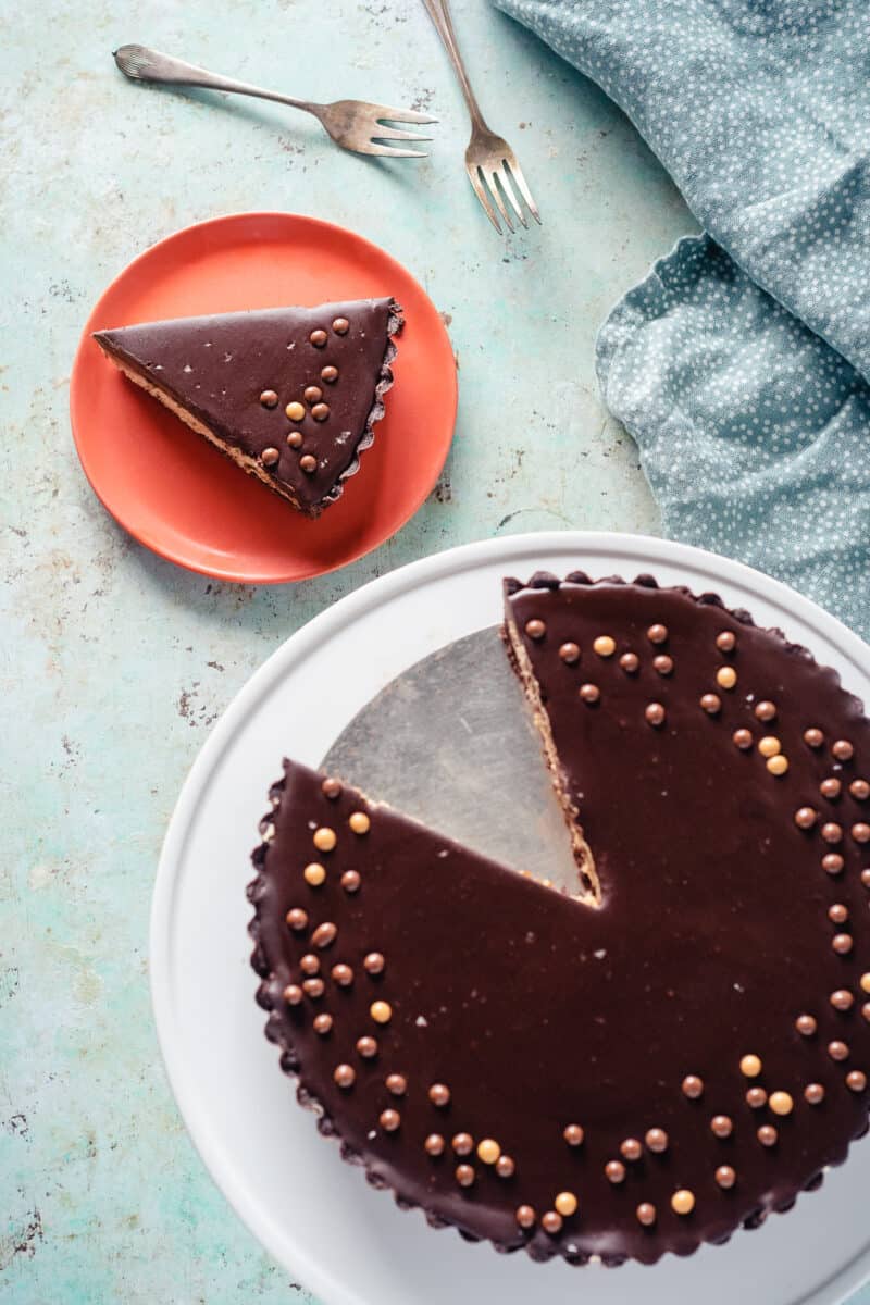 Chocolate peanut butter tart with slice removed