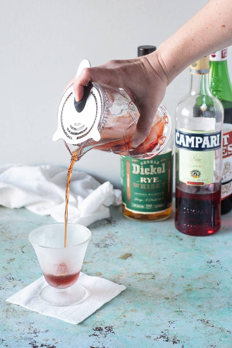 Straining the Boulevardier into a chilled glass