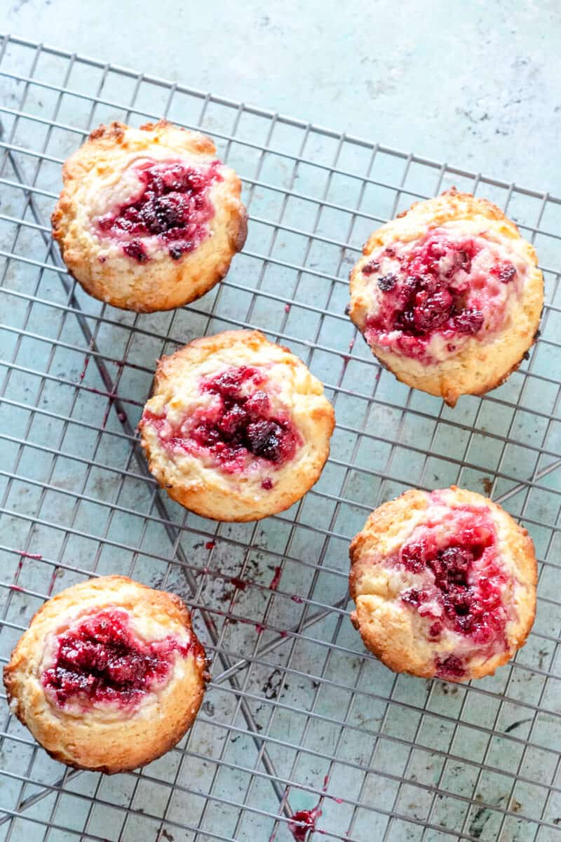 Raspberry lemon muffins on a cooling rack, overhead shot