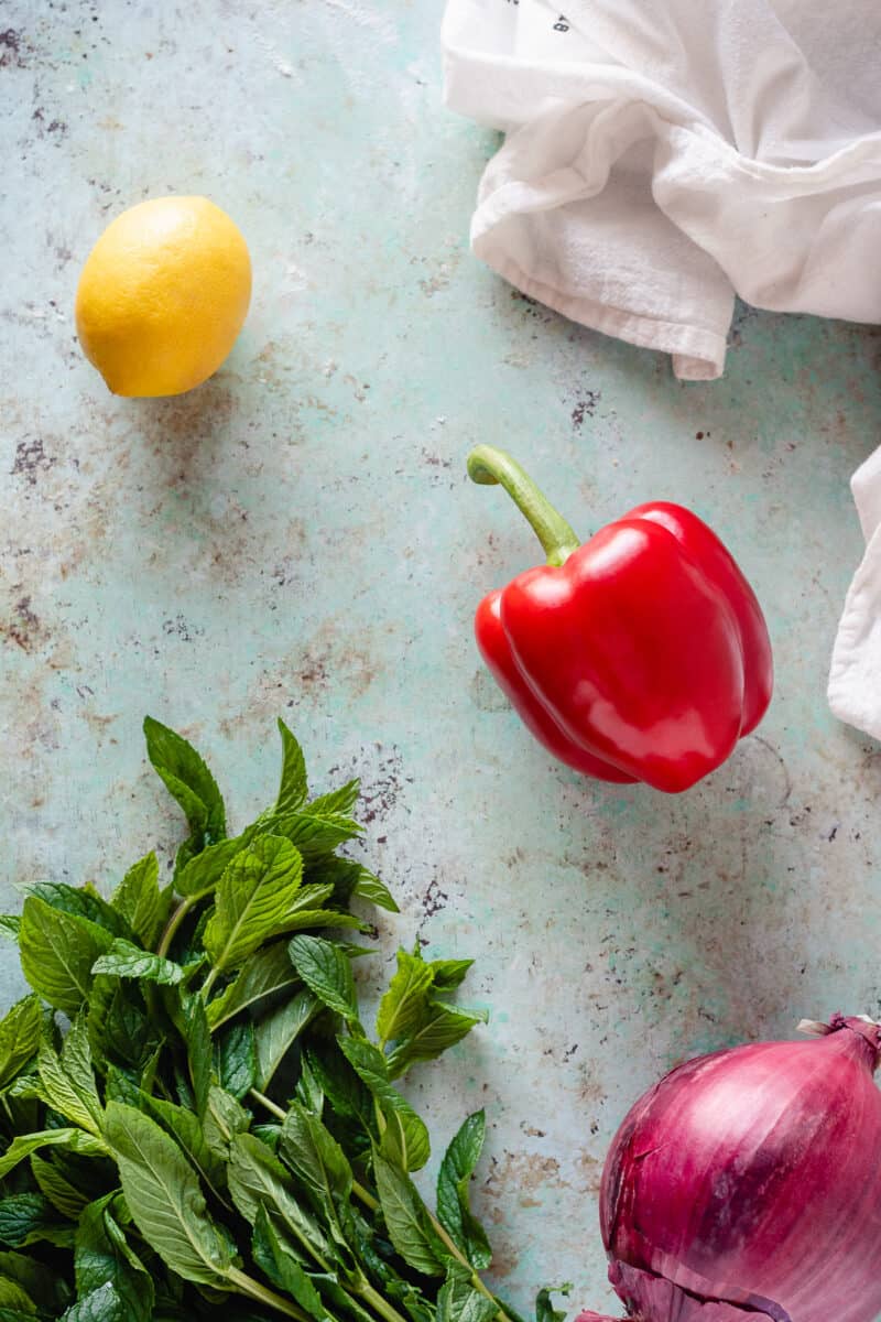 Lemon, red bell pepper, red onion, bunch of mint