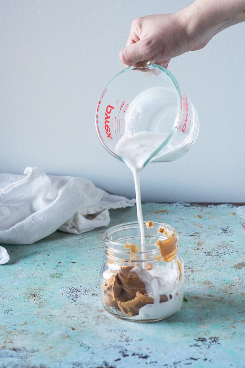 Coconut milk poured into a jar