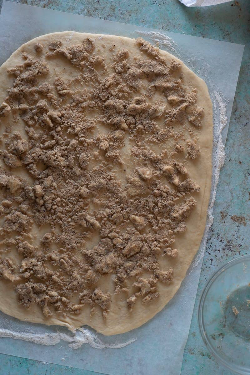 Rolled out dough sprinkled with a coffee-cardamom-brown sugar mixture
