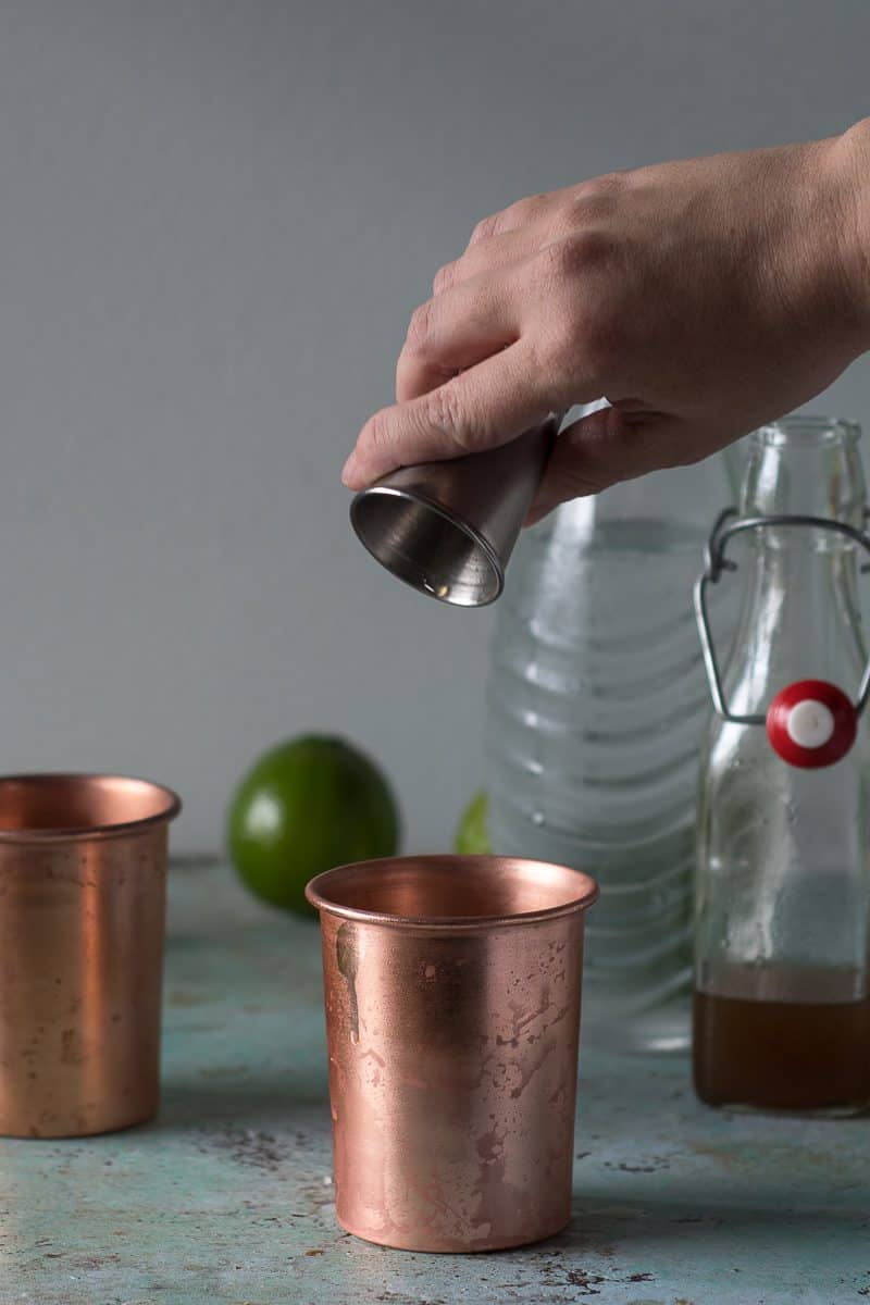 Pouring mezcal from a jigger