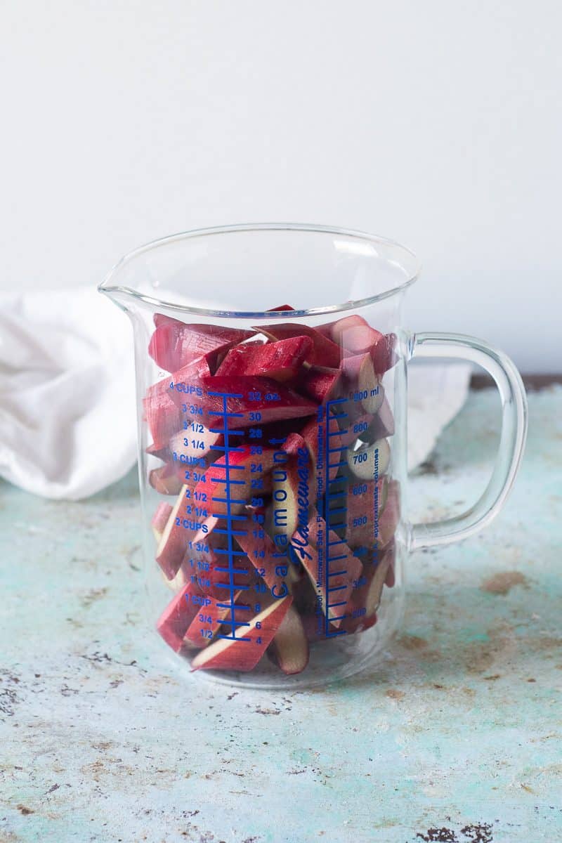 Sliced rhubarb in a measuring cup