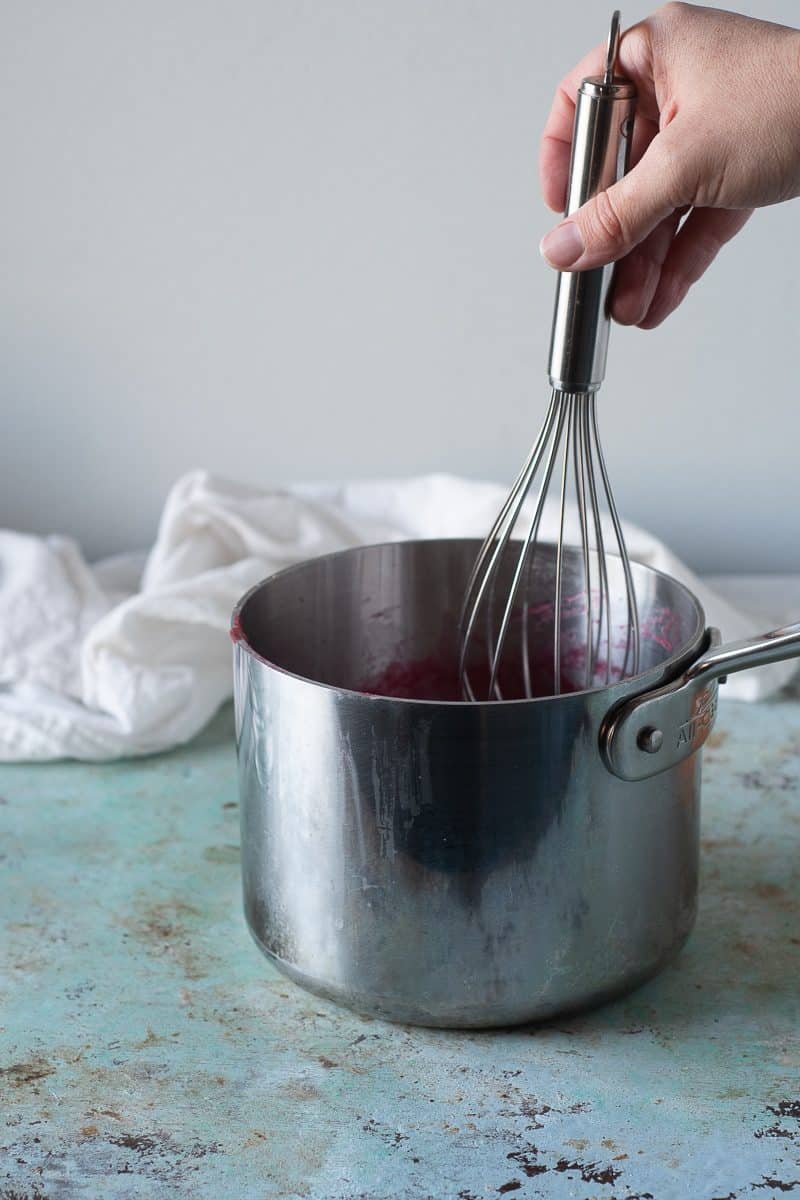 Whisking sugar into the rhubarb puree