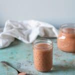 Rhubarb curd in jars and mounded on a spoon