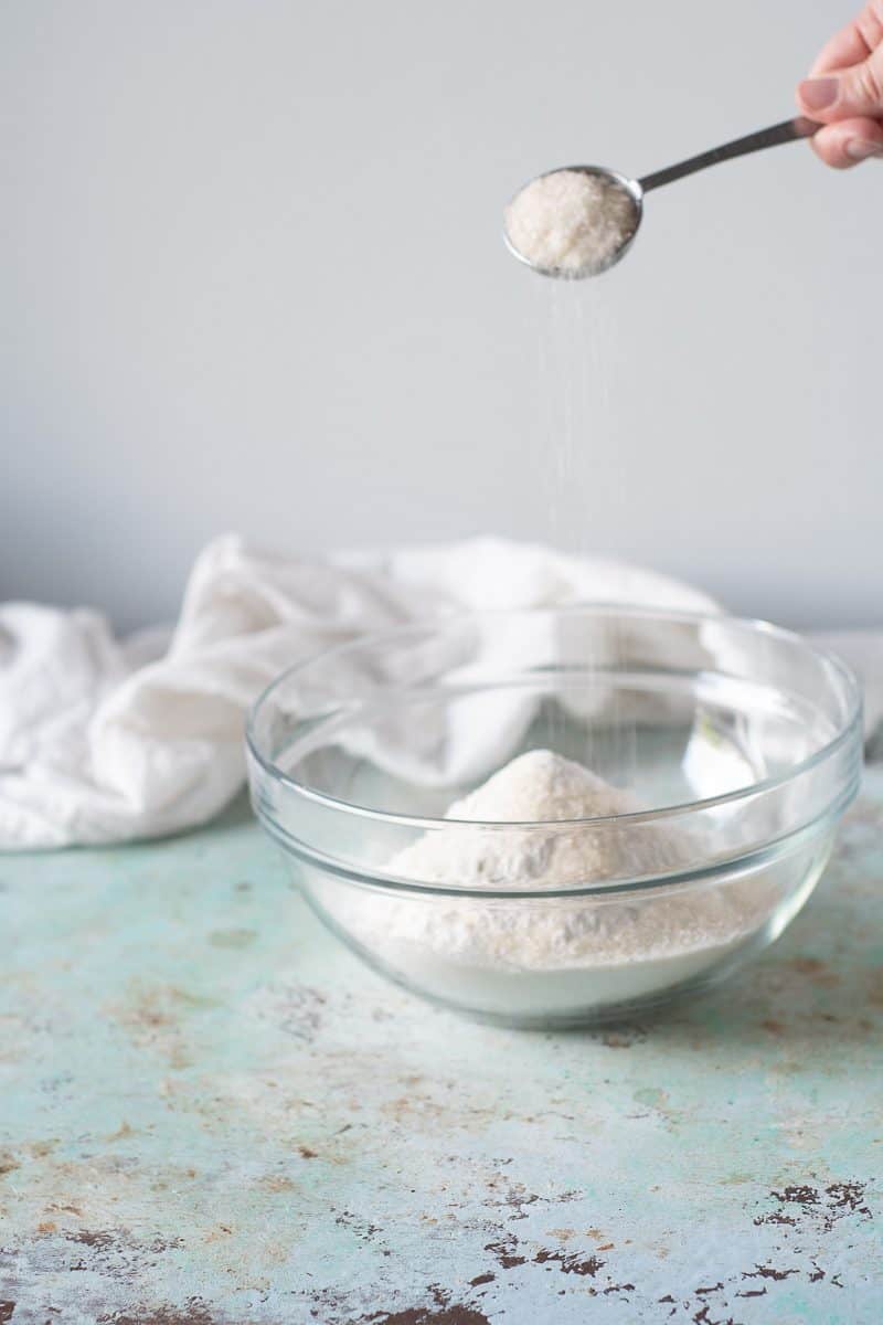 Sugar being added to flour