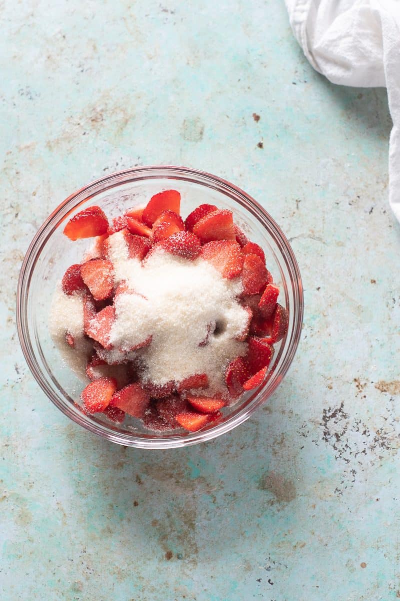 Sliced strawberries with sugar on top