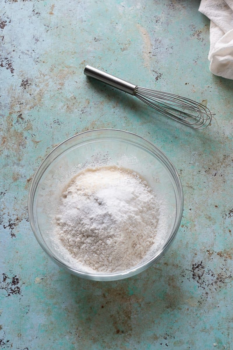 Flour, baking powder, baking soda, sugar, and salt in a bowl