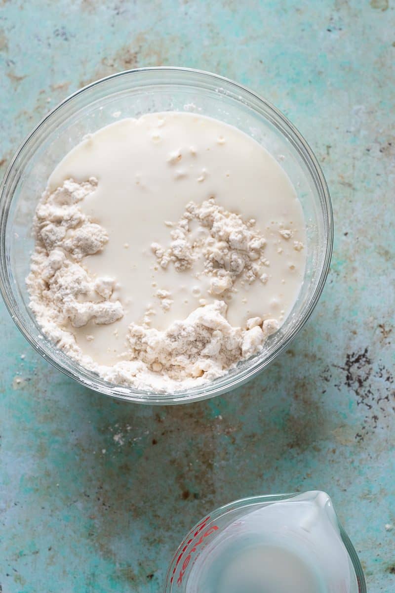 Buttermilk added to flour mixture overhead shot