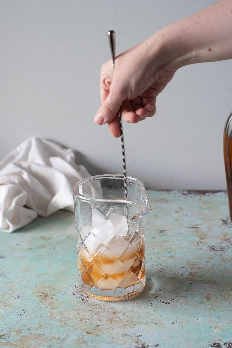 Stirring the Old Fashioned in a mixing glass